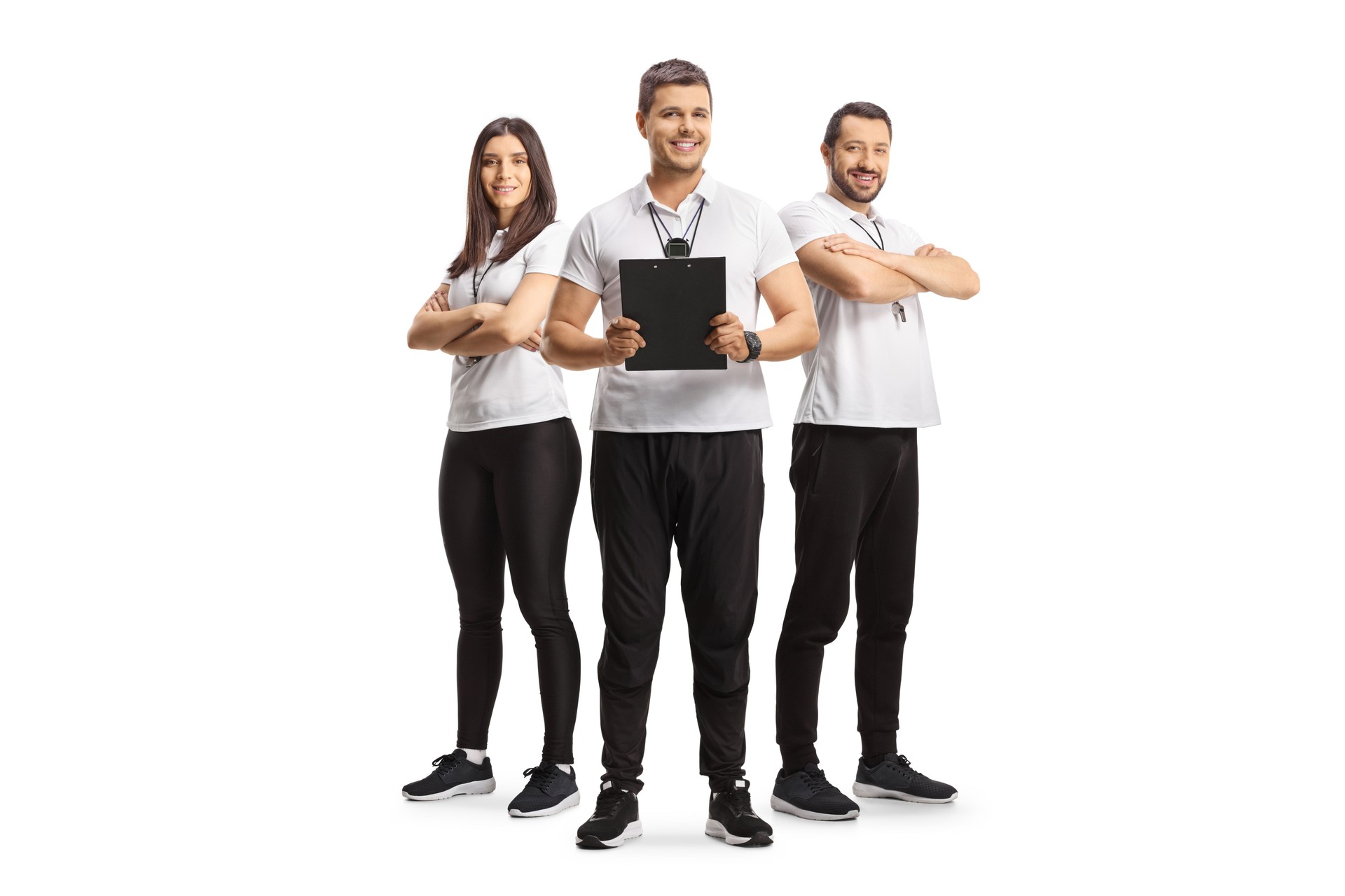 Team of sports coaches posing together